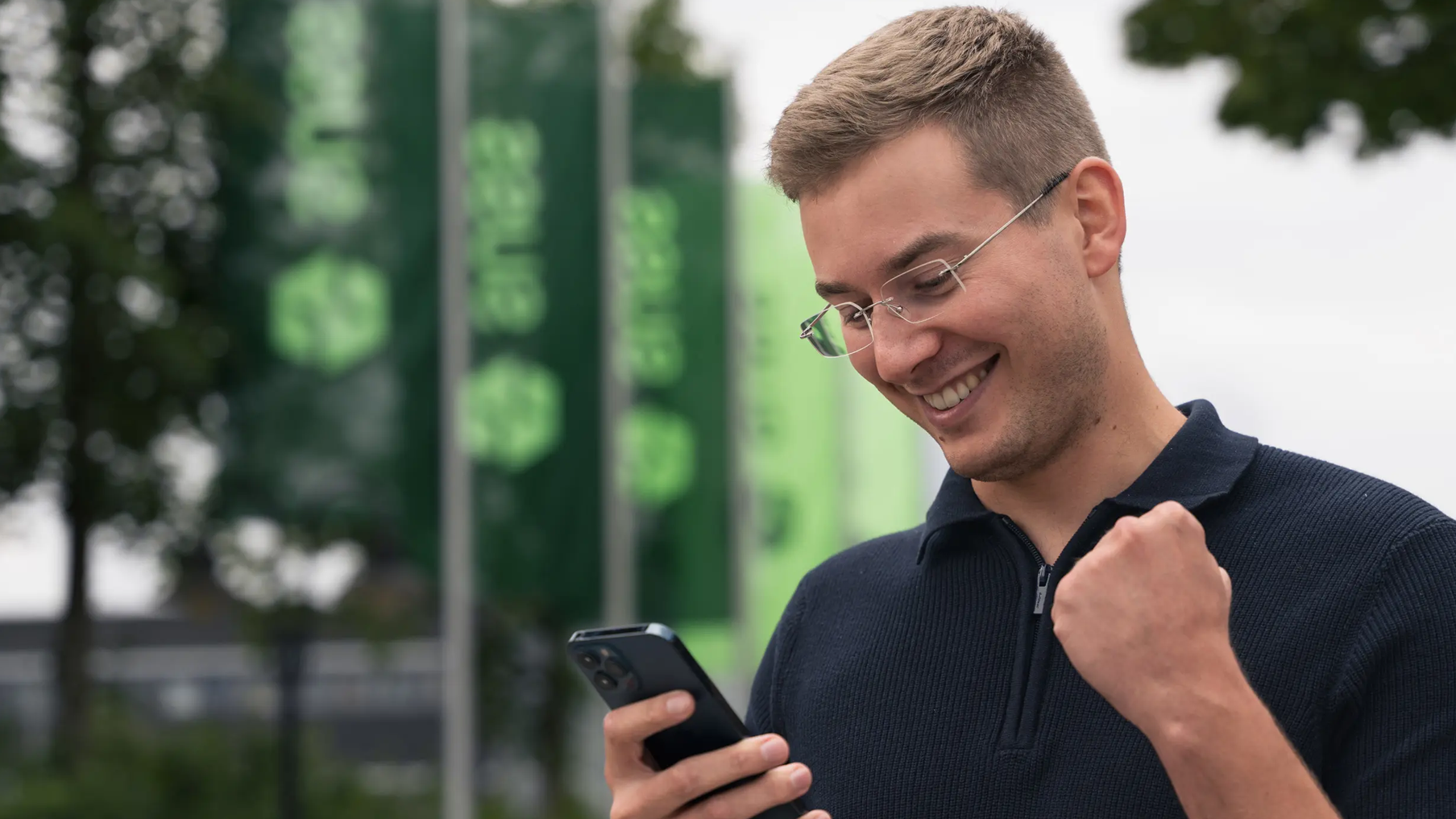 Cheerful Man Looking at his Phone