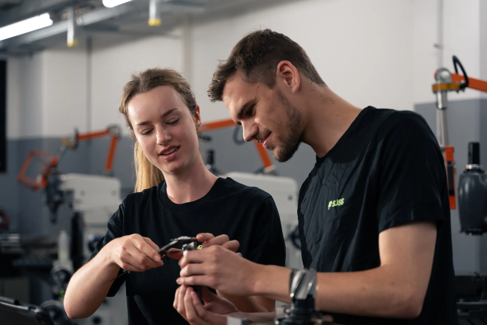Young Woman and Men with Tools