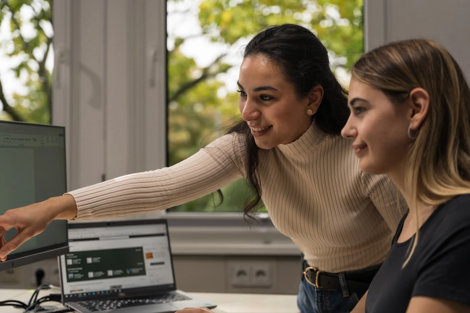 Two Women Looking at Screen