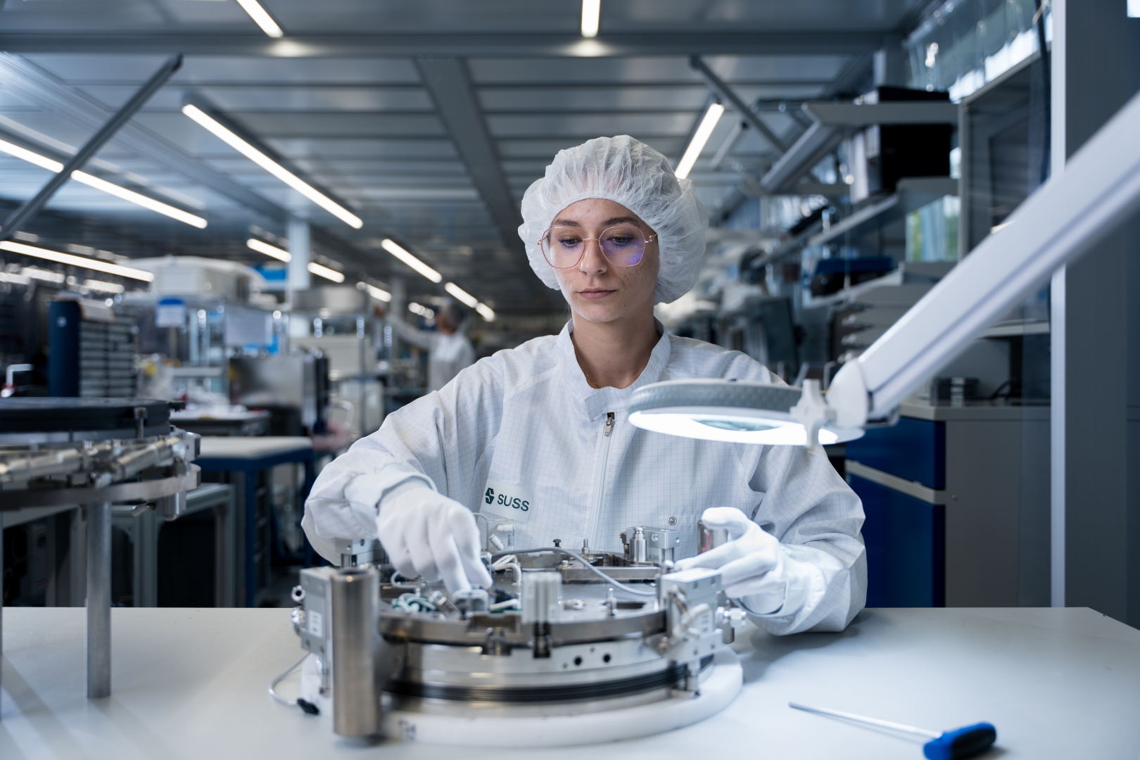 Woman in Protection Wear Checking Machine