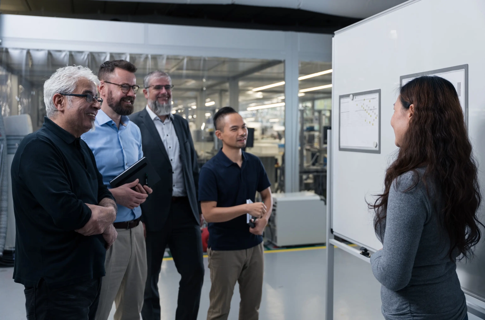 Woman Presents Agenda to Team
