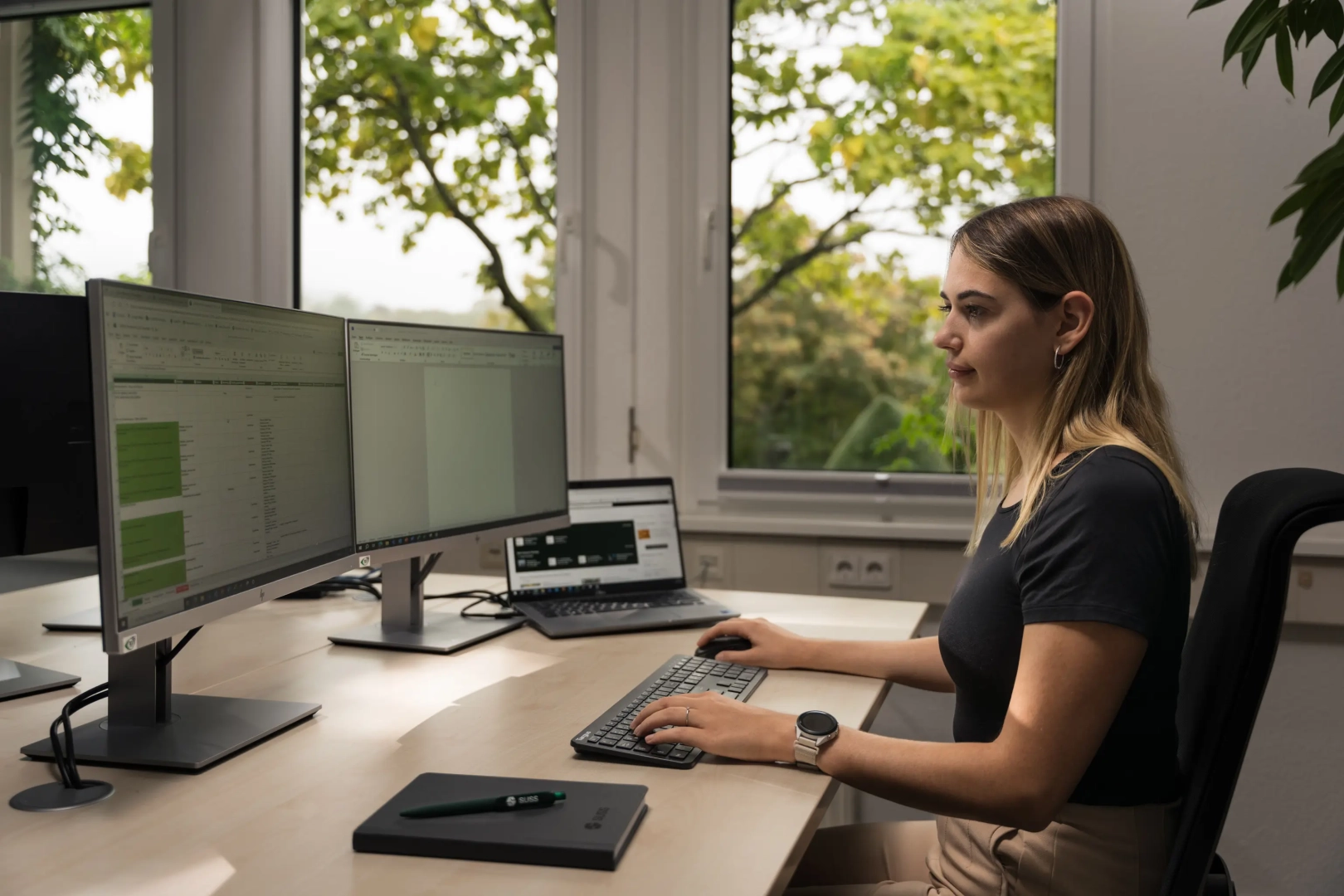 Young Focused Woman at Desk