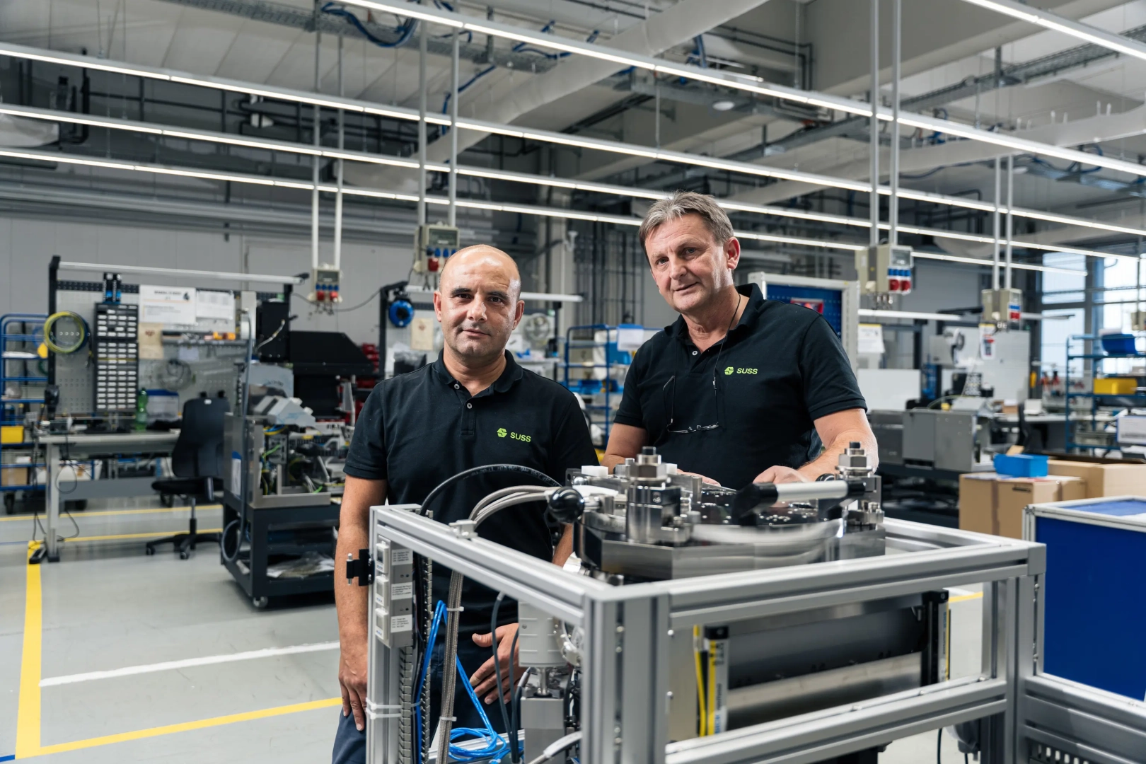 Two Men in Industrial Machine Hall